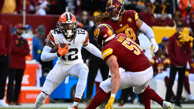 Jan 1, 2023; Landover, Maryland, USA; Cleveland Browns wide receiver Michael Woods II (12) runs after a catch as Washington Commanders linebacker David Mayo (51) defends during the second half at FedExField.